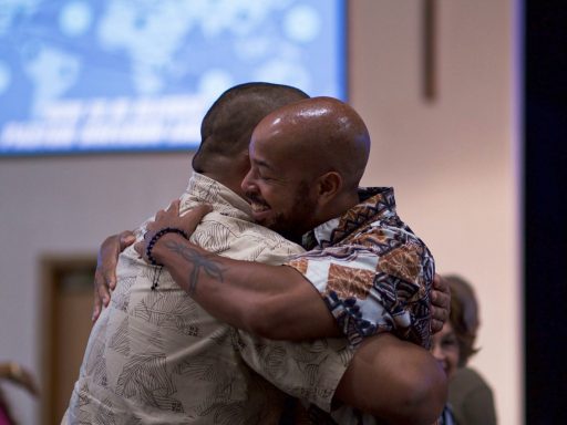 two man hugging on focus photography